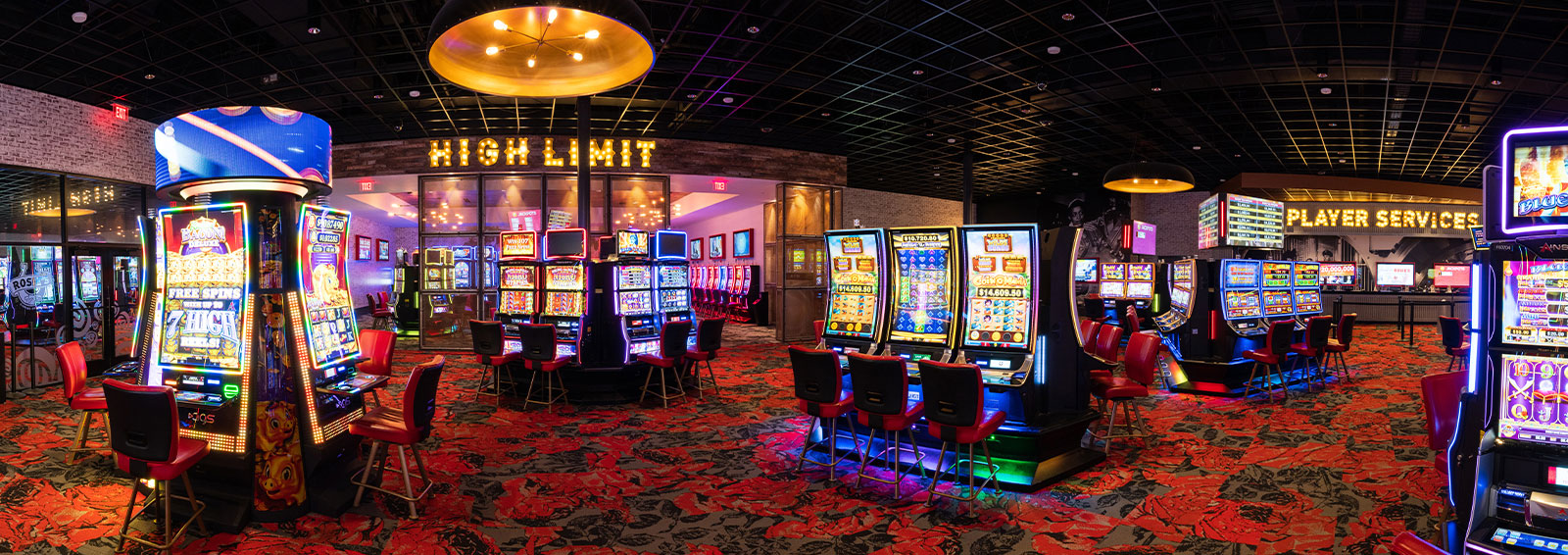 jockey riding horse with scoreboard in background